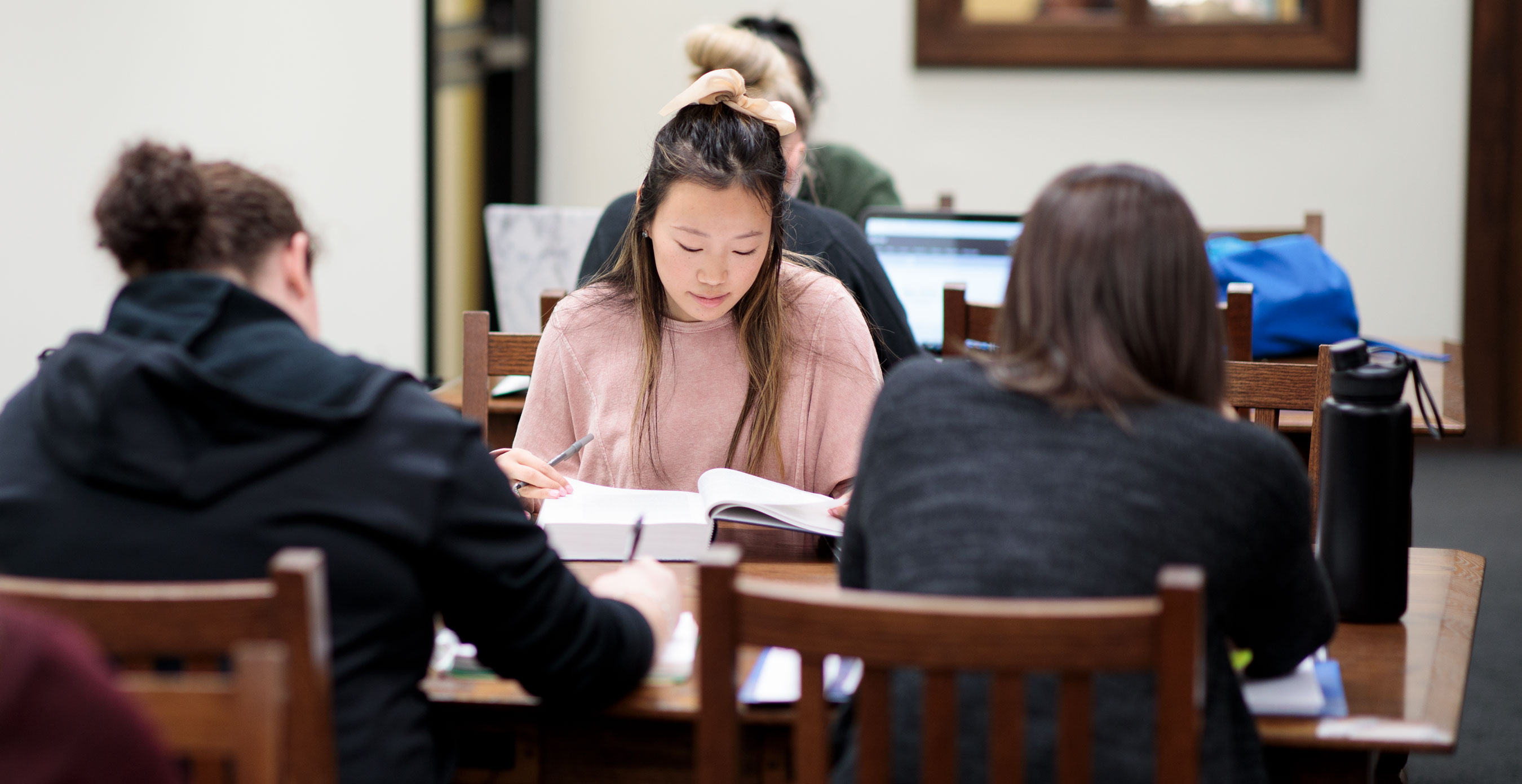 Students studying for exams in the library on campus.