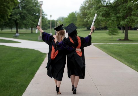 Photo of 2 graduates