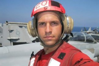 U.S. Navy veteran James Lee of Lima, Ohio, standing on a flight deck.